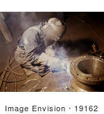 #19162 Photo Of A Welder Crouching While Making Boilers For A Ship
