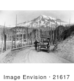 #21617 Historical Stock Photography Of A Man Viewing A Mountain And Forest Fire Damage During A Detroit Electric Automobile From Seattle To Mt Rainier Tour In Washington In 1919