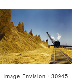 #30945 Stock Photo Of A Dragline Excavator On The Railroad Tracks Loading Boxcars Full Of Sulphur At A Vat At The Freeport Sulphur Company In Hoskins Mound Texas