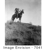 #7041 Stock Photography: Apsaroke Man With Bow And Arrows On Horse