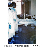 #8380 Picture Of Two Nurses Standing In Front Of A Patient Who Is Infected With The Ebola Virus - 1976