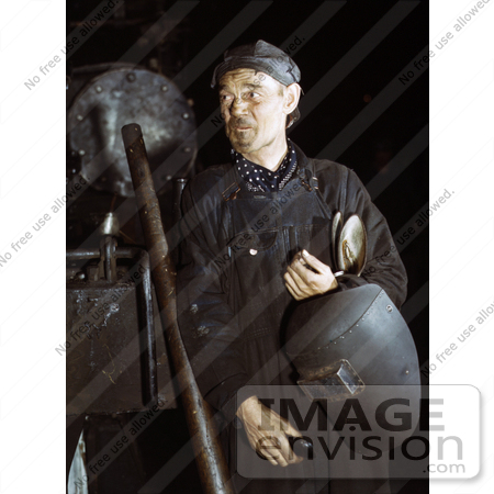 #19158 Photo of a Male Welder in Coveralls, Holding a Helmet, 1942 by JVPD