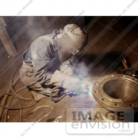#19162 Photo of a Welder Crouching While Making Boilers For a Ship by JVPD