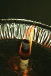 Free Picture of Burning Ear Candle with an Aluminum Pan