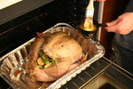 Free Picture of Person Buttering a Turkey With a Brush