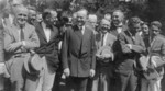 Free Picture of President Coolidge Standing With Newspaper Correspondents