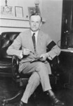 Free Picture of Calvin Coolidge Seated at Desk