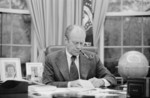 Free Picture of Gerald Ford Working at His Desk, Smoking a Pipe