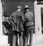 Free Picture of Men Looking in Store Window