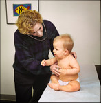 Free Picture of Physician Examining a 9 Month Old Baby