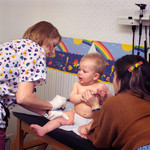 Free Picture of Physician and an Assistant Administering a Hepatitis B Vaccination to a 9 Month Old Baby