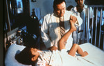 Free Picture of Doctor Examining a Child with Polio Disease