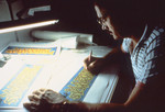 Free Picture of 1980’s Graphic Artist Travis Benton Working at a Drafting Table