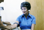 Free Picture of Health Practitioner Obtaining a Blood Sample from a Female Patient