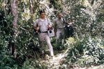 Free Picture of Researchers Transporting Light Trap Equipment During an Arbovirus Field Study