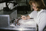 Free Picture of Laboratorian Working with Mosquito Filled Tubes that were used in a Virus Isolation Study