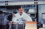 Free Picture of Lab Technician Pipetting Specimens While he Conducts Laboratory Research