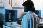 Free Picture of Laboratory Technician Using a Cetus Propette to Collect Scientific Data - 1980