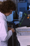 Free Picture of Scientist Using a Multi-Channel Pipette to Dispensing Lab Samples