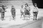 Free Picture of Children Riding Tricycles