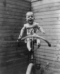 Free Picture of Baby Sitting on Unicycle