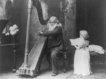 Free Picture of Man Playing Harp, Child Singing