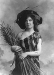Free Picture of Woman in Serape Holding Wheat