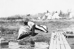 Free Picture of Ojibwa Indian Fixing Canoe
