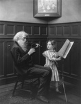 Free Picture of Old Man Playing Violin, Girl Turning Sheet Music