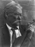 Free Picture of Man Holding Violin