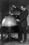 Free Picture of John Phillip Hill Pouring Water on Globe, Prohibition