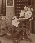 Free Picture of Man Kissing a Woman While Cutting Her Hair