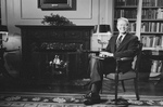 Free Picture of Jimmy Carter Sitting by a Fireplace