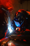 Free Picture of Soldier Welding to Repair a Munitions Stand