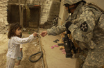 Free Picture of Soldier Giving Candy to a Girl