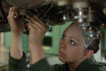 Free Picture of Female Soldier Working on a Jet Engine
