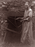 Free Picture of Woman by a Spinning Wheel