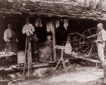 Free Picture of Family Using Spinning Wheels