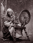 Free Picture of Woman Using a Spinning Wheel