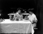 Free Picture of Two Women Using a Toaster at a Table