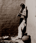 Free Picture of American Indian Playing an Instrument