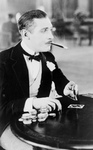 Free Picture of Man Smoking and Playing Cards