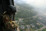 Free Picture of Soldier Overlooking a City From a Helicopter