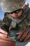 Free Picture of Soldier Using a Map and Compass