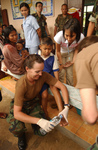 Free Picture of Doctor Assisting a Child