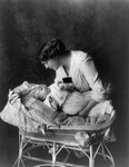 Free Picture of Ethel Barrymore Putting a Baby in a Crib