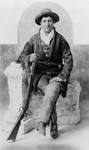 Free Picture of Calamity Jane Sitting With a Rifle