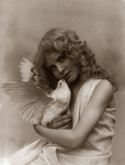 Free Picture of Angelic Girl Holding a Dove