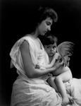 Free Picture of Mother Clipping Her Baby Angel’s Wings