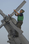 Free Picture of Soldier During Corrosion Maintenance on a Military Helicopter